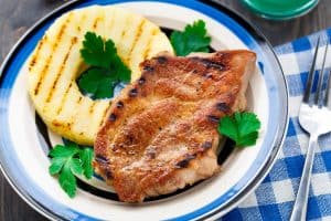 Grilled Pork Chops with Red Wine reduction sauce / Grilled Pineapple and Steamed Veggies.