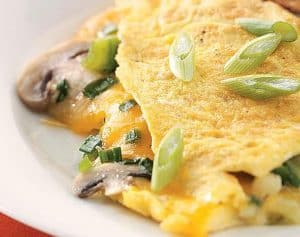 Cheddar and Veggies Stuffed Omelette w/ Roasted Tomatoes